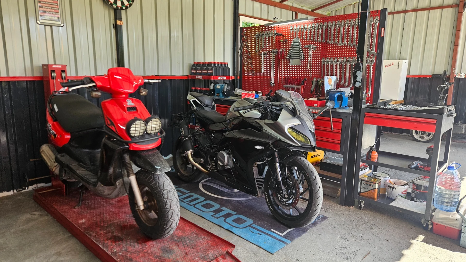Red Yamaha BWS and CFMOTO 250SR in the real Nail Motor workshop